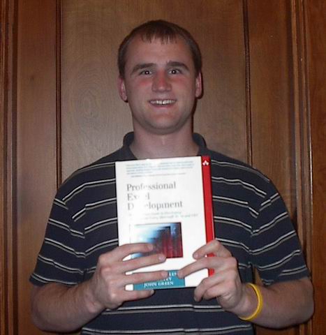 Bill holding a copy of the book